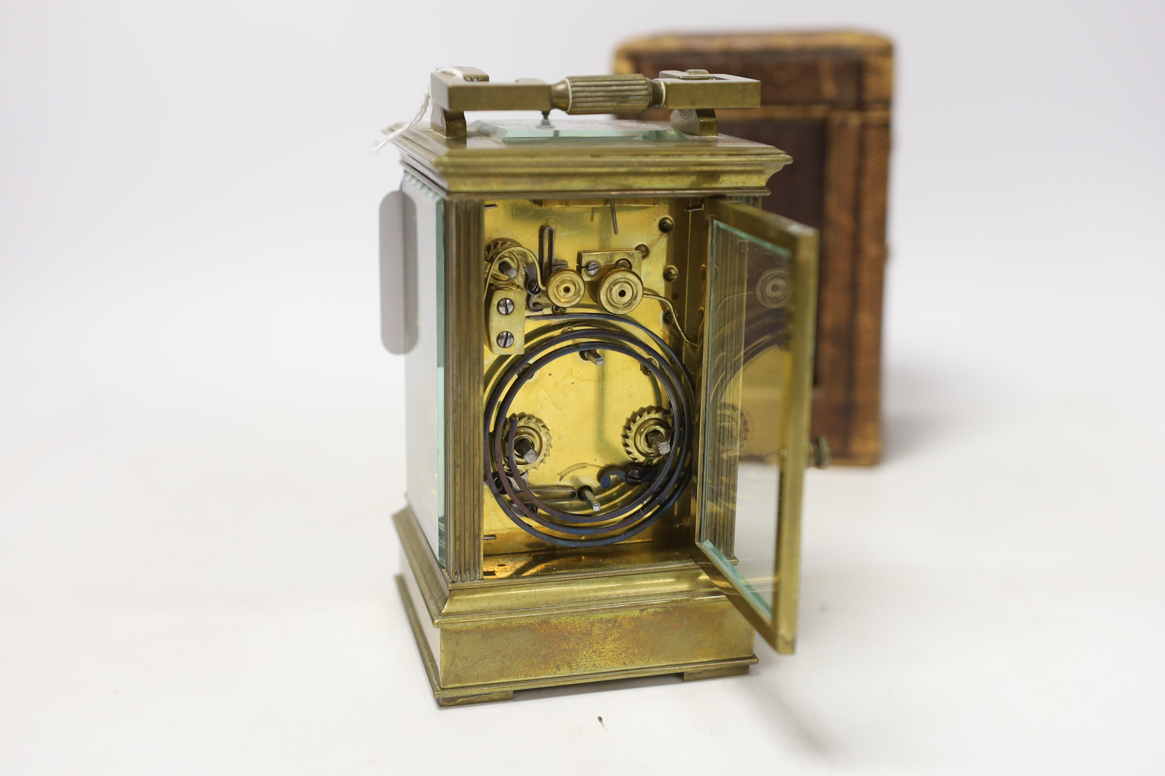 A cased early 20th century brass repeating carriage clock with alarm, 15.5cm